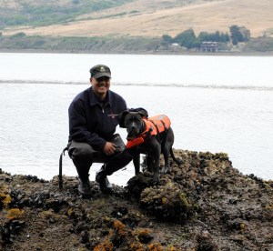 My trusty sidekick, Wilson, helping me do some field work in Tomales Bay. Note the Type-DOG PFD, safety first!